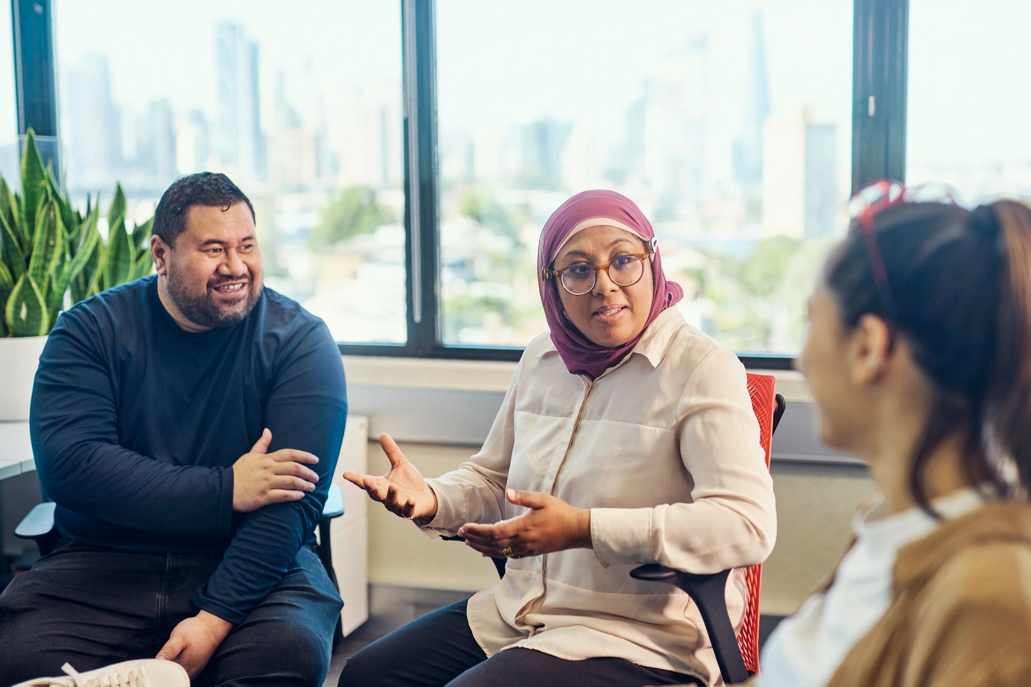 Professionals collaborating in a supportive meeting