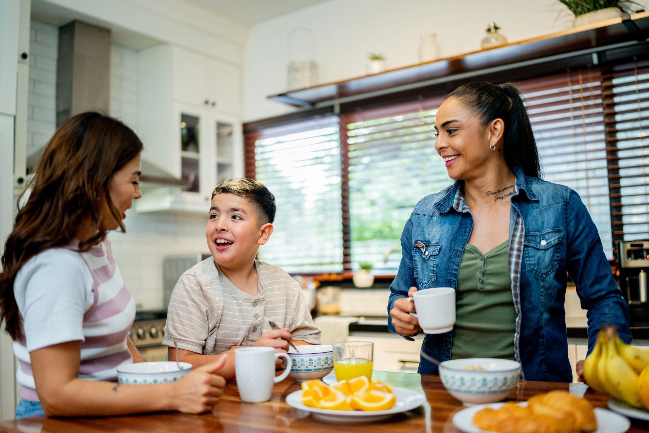 Family talking together during breakfast at home