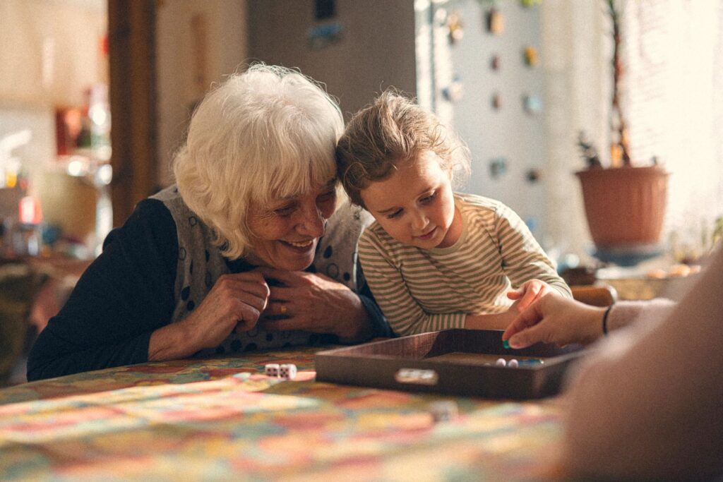Family Care. Playing Board Game and Sharing Fun Moments